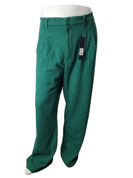 Green pants on a mannequin with a white background