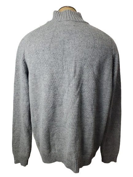 Gray sweater on a mannequin against a white background