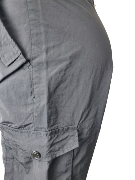 black pants with a button detail on a white background