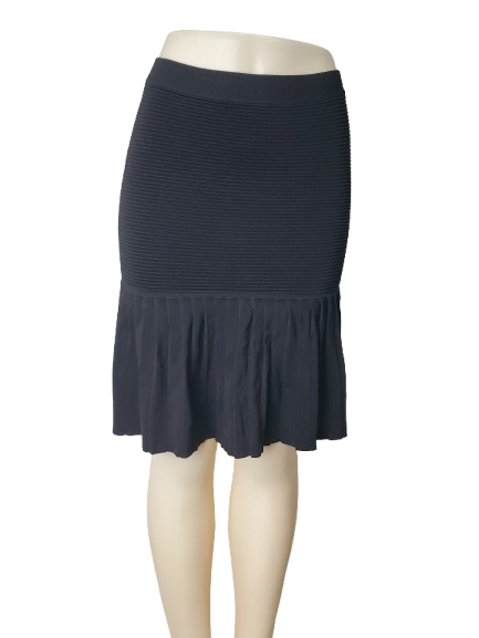 Black skirt on a mannequin against a white background