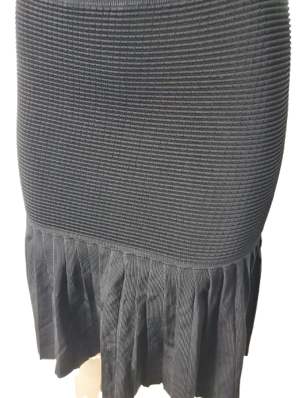 black skirt with a textured pattern on a white background