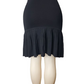 Black skirt with ruffled bottom on a mannequin against a white background