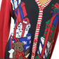 Colorful Christmas-themed sweater with teddy bear and gift box design.
