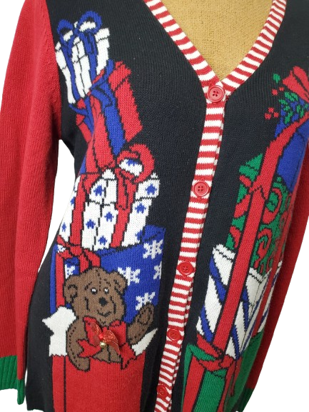 Colorful Christmas-themed sweater with teddy bear and gift box design.