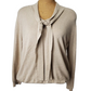 Beige cardigan on a mannequin against a white background