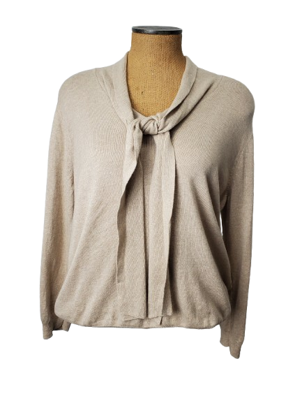 Beige cardigan on a mannequin against a white background