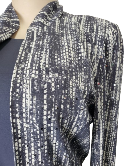 Patterned scarf draped over a mannequin on a white background