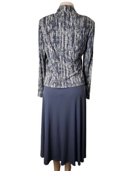 gray and white patterned top with a navy skirt on a mannequin against a white background