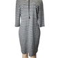 Black and gray striped dress on a mannequin against a white background