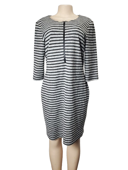 Black and gray striped dress on a mannequin against a white background