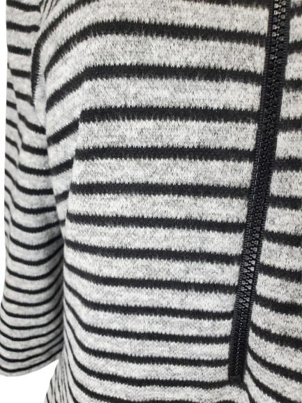 Close-up of a black and gray striped sweater with a zipper.