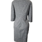 Mannequin wearing a black and gray striped dress on a white background