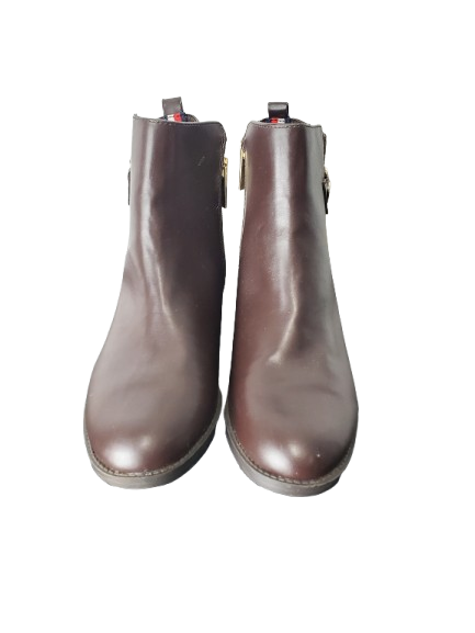 Pair of brown ankle boots on a white background