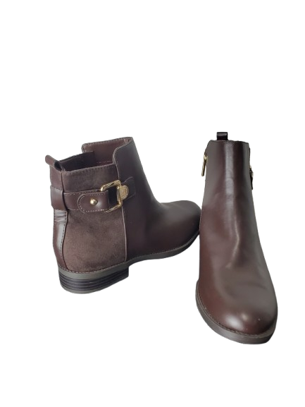 Pair of brown leather ankle boots on a white background