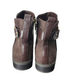 Pair of brown leather boots with zippers on a white background
