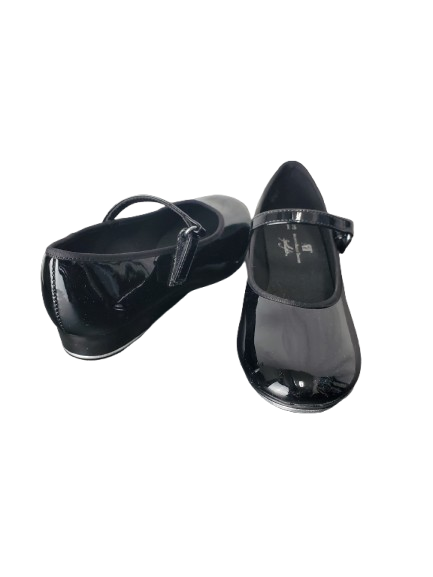 Black patent leather shoes on a white background