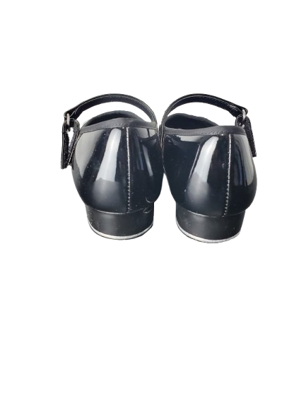 Pair of black shoes with a strap on a white background