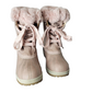 Pair of pink winter boots with fur trim on a white background