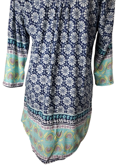 Long-sleeve dress with blue and white geometric pattern on a white background