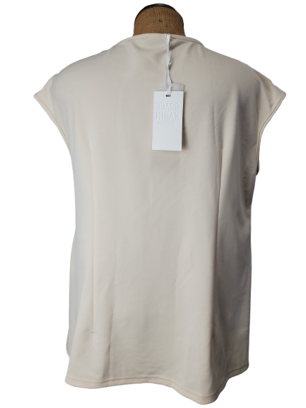 Beige sleeveless top on a mannequin with a white background