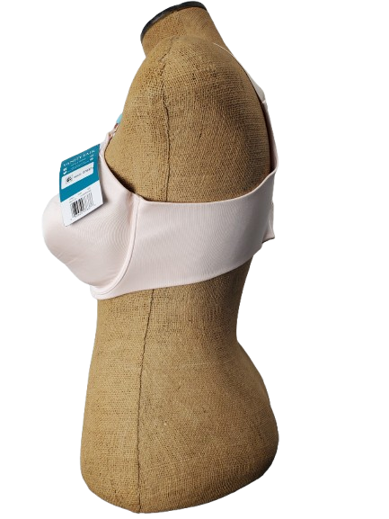 Mannequin wearing a beige bra with a strap and a visible tag on background