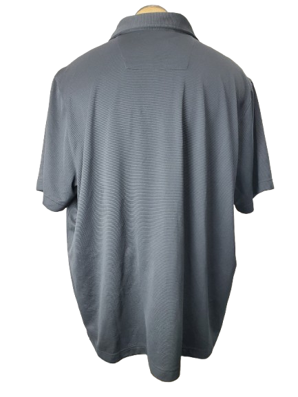 black polo shirt on a mannequin against a white background