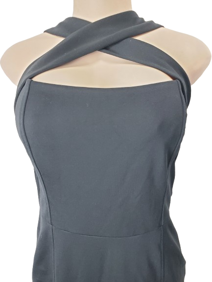 Black sleeveless top with criss-cross front on a mannequin against a white background