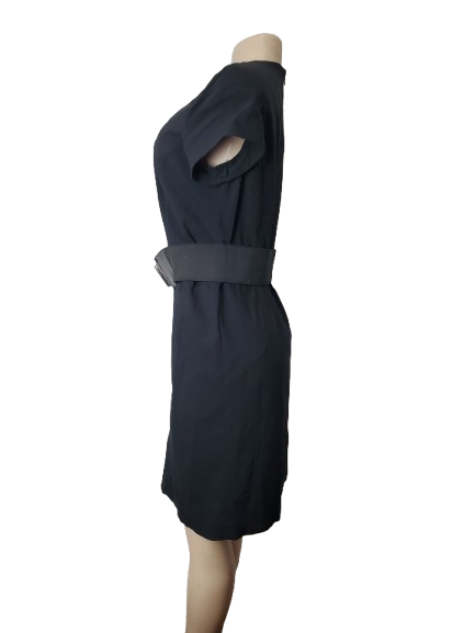 Black dress on a mannequin against a white background