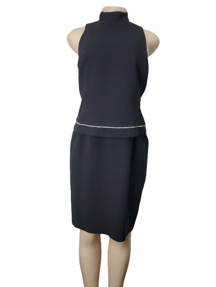 Black sleeveless top and skirt set on a mannequin against a white background