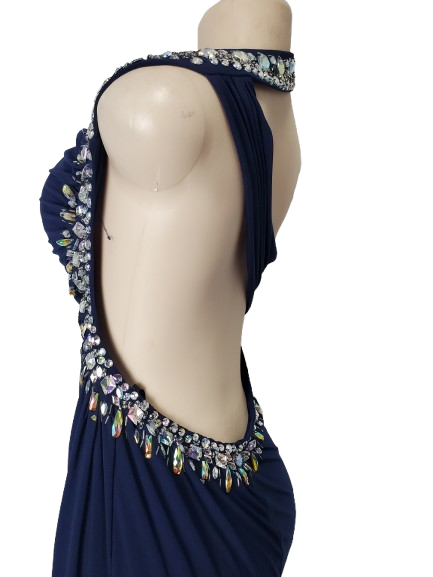 Navy blue evening gown with intricate beadwork on a mannequin against a white background