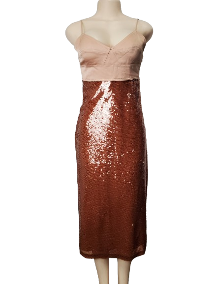 Mannequin wearing a beige top and brown sequin skirt on a white background