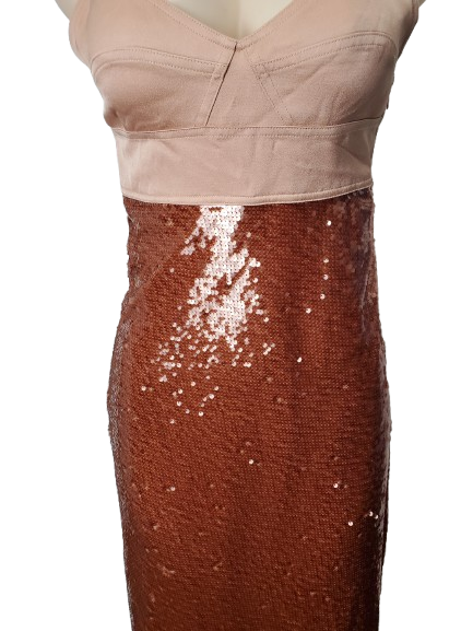 Beige top and brown sequined skirt on a mannequin against a white background