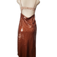 Mannequin wearing a copper sequin skirt and top on a white background