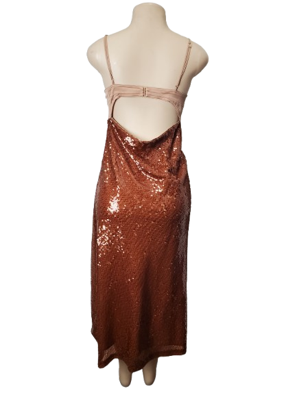 Mannequin wearing a copper sequin skirt and top on a white background