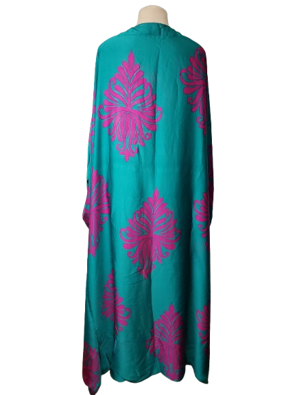 green cardigan with pink floral patterns on a white background