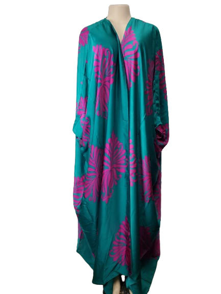 Teal dress with pink floral patterns on a mannequin against a white background