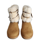 Pair of tan boots with white fur trim on a white background