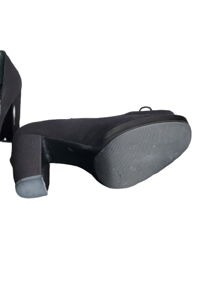 Black high-heeled shoe on a white background