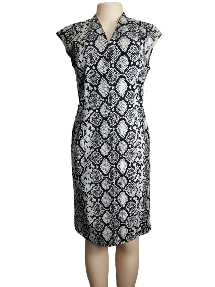 Black and white patterned dress on a mannequin against a white background