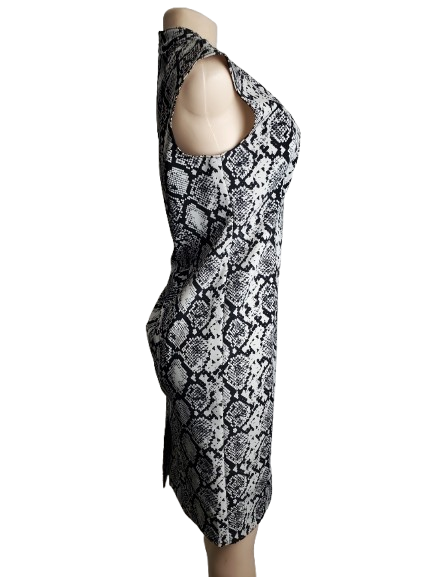Black and white patterned dress on a mannequin against a white background