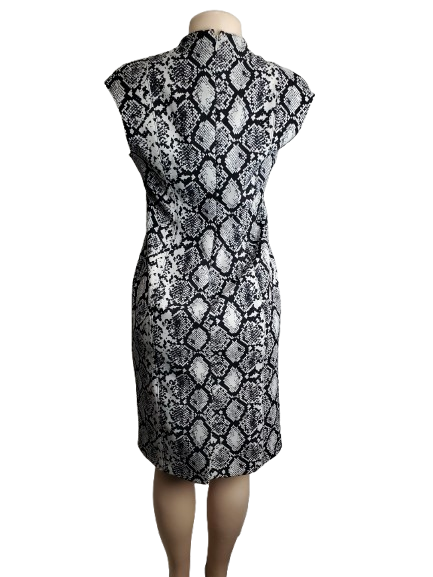 Black and white patterned dress on a mannequin against a white background