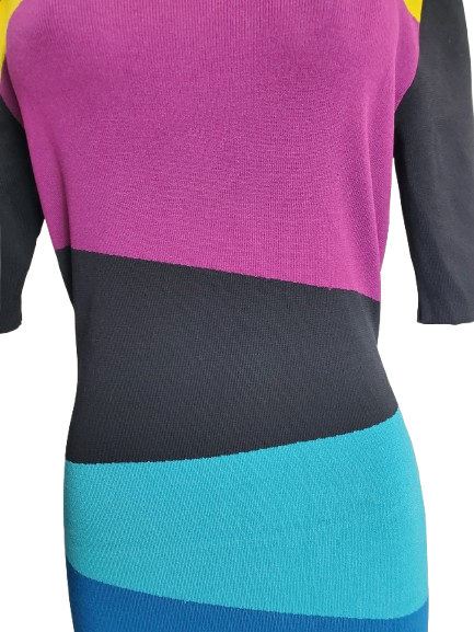 Color-blocked sweater with purple, black, and blue sections.