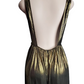 Mannequin wearing a black and gold dress with a sheer overlay on a white background