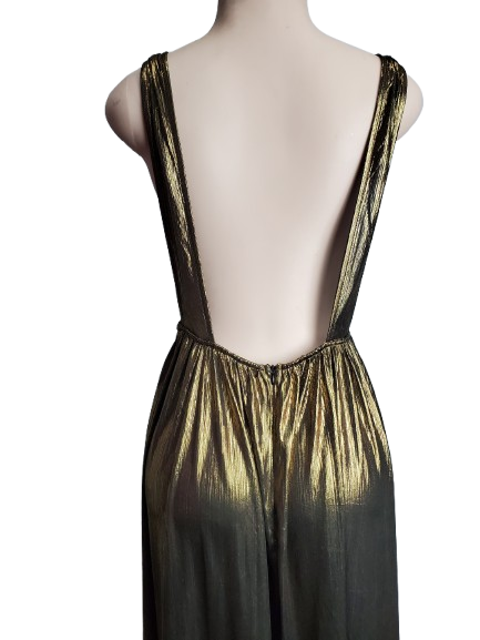 Mannequin wearing a black and gold dress with a sheer overlay on a white background