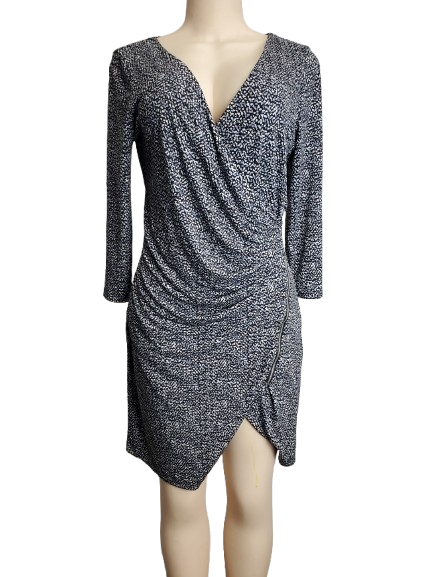 Black and white patterned dress on a mannequin against a white background