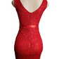 Red lace dress on a mannequin against a white background