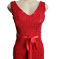 Red lace dress with a belt on a mannequin against a white background