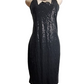 Black sequin party dress on a mannequin against a white background