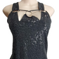 Black sequin dress on a mannequin against a white background