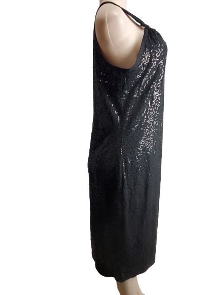 Black sequin dress on a mannequin against a white background
